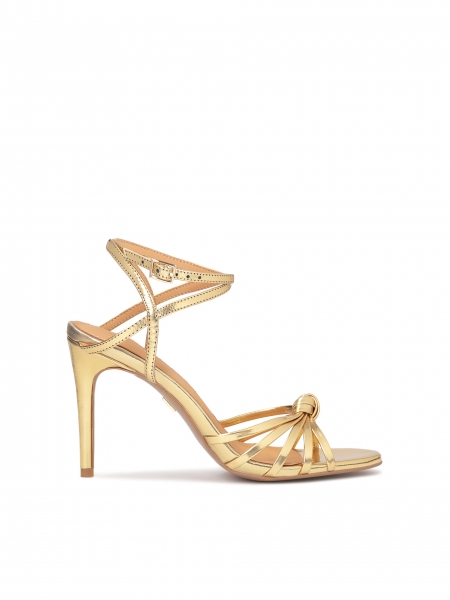Elegant golden sandals with angled straps DIAMANTE