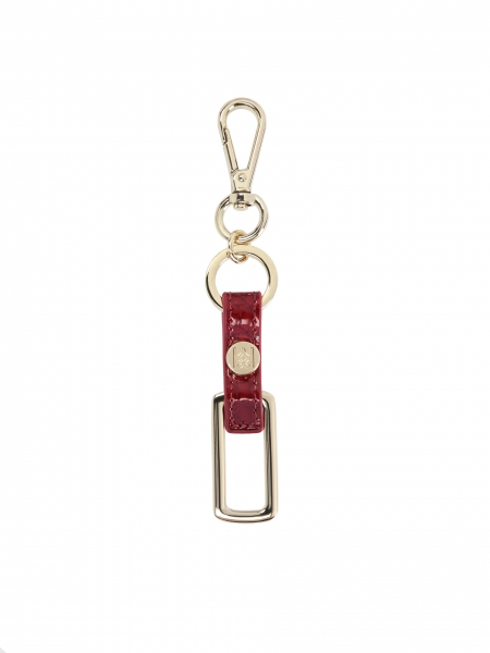 Charming keychain pendant in red embossed leather and metal 