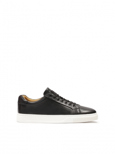 Black sneakers on a white sole AJAKS