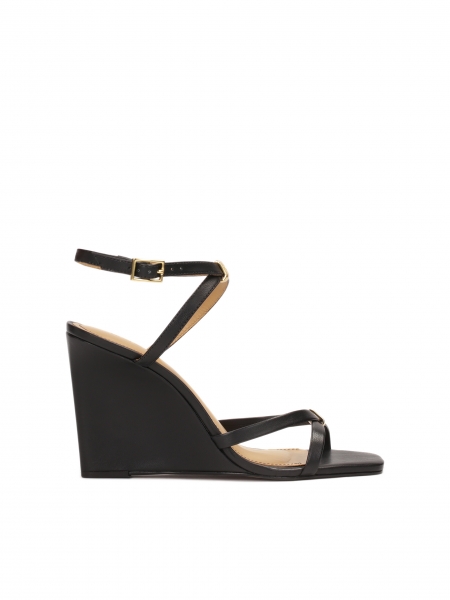 Leather sandals on a platform with crossed straps SONNIE